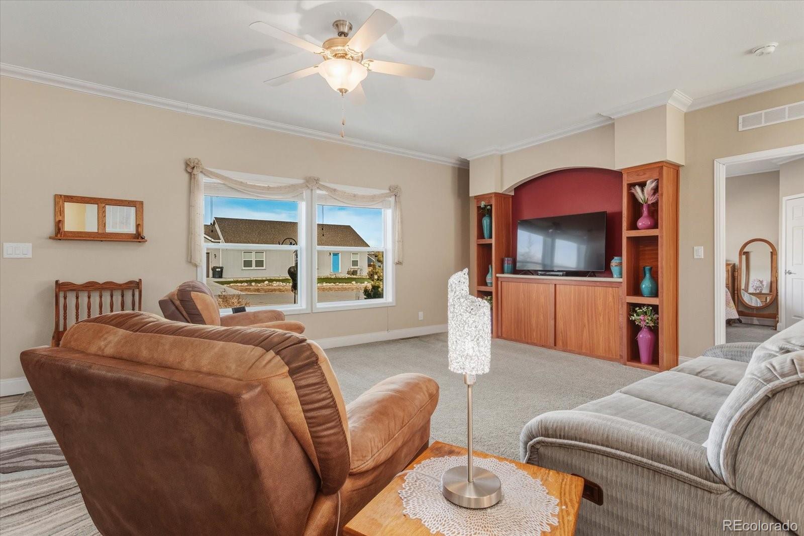 655 Quarry Station Poncha Springs, CO 81242 - Photo 4 of 42 a living room with furniture and a flat screen tv