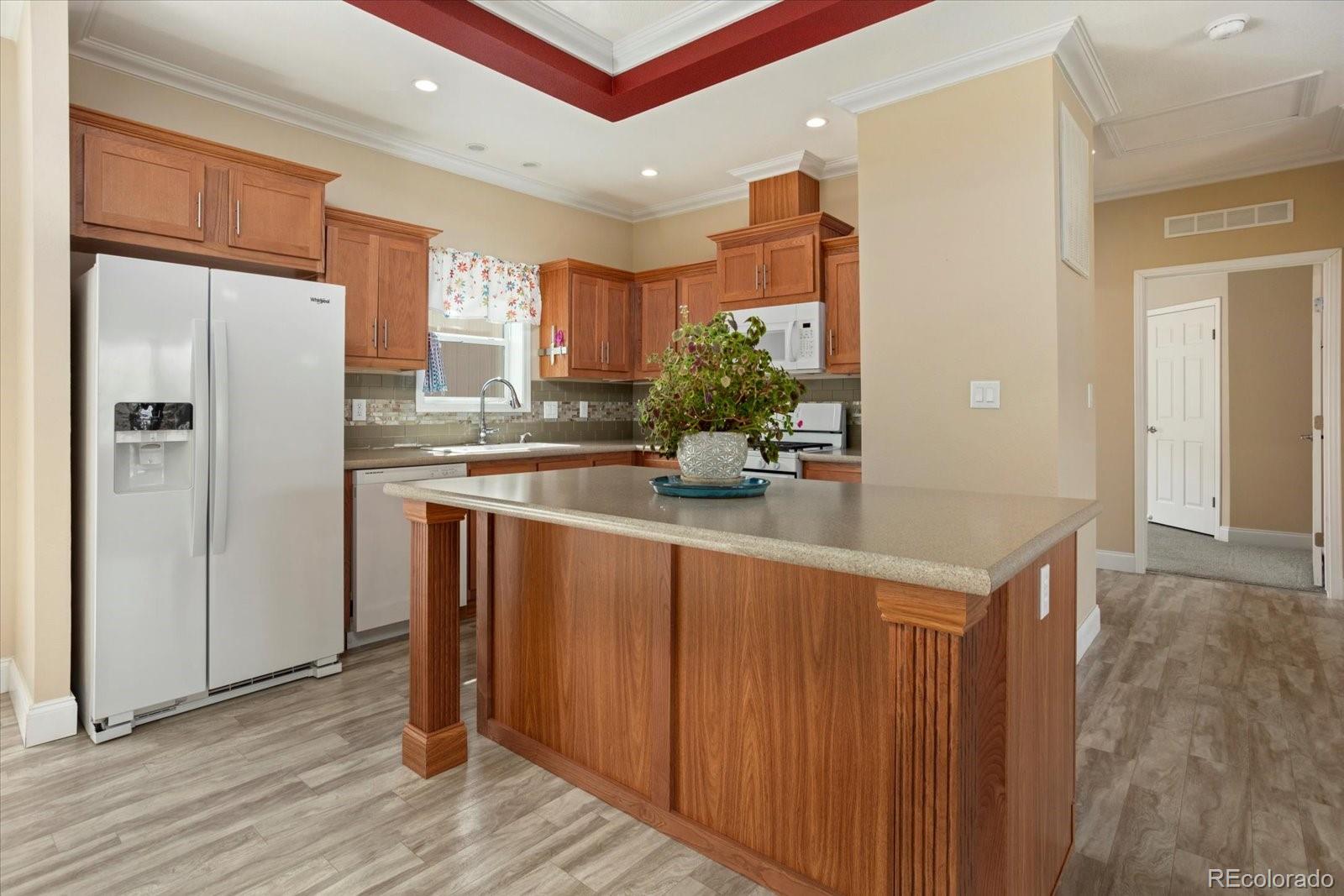 655 Quarry Station Poncha Springs, CO 81242 - Photo 5 of 41 a kitchen with granite countertop a refrigerator and a sink