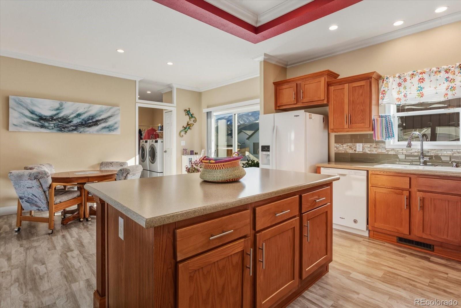 655 Quarry Station Poncha Springs, CO 81242 - Photo 7 of 42 a kitchen with a sink cabinets and wooden floor
