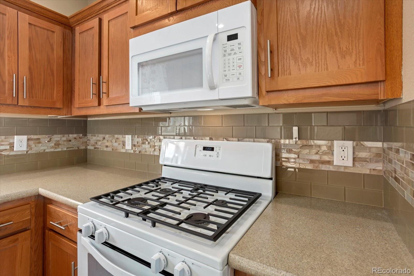 655 Quarry Station Poncha Springs, CO 81242 - Photo 8 of 41 a stove top oven sitting inside of a kitchen