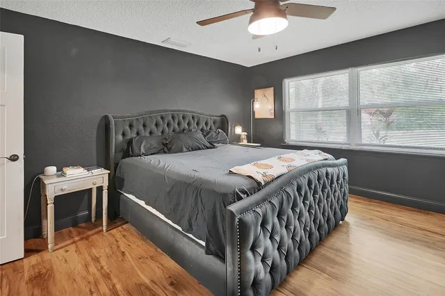 a bedroom with a bed and a fireplace