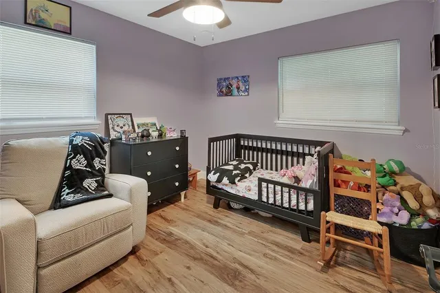 a bed room with furniture and a window