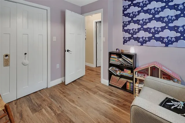 a view of a livingroom with furniture and wooden floor