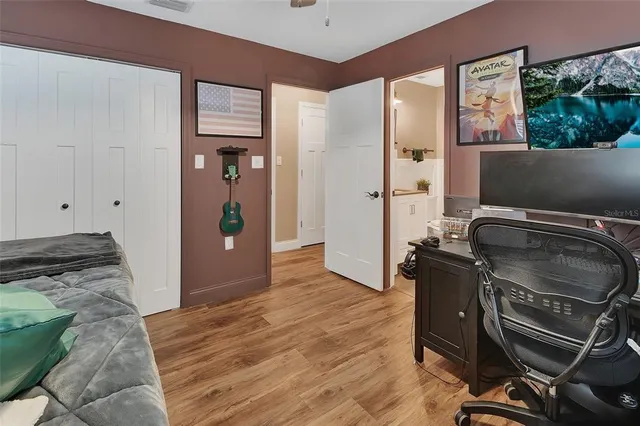 a kitchen with granite countertop a stove and a refrigerator