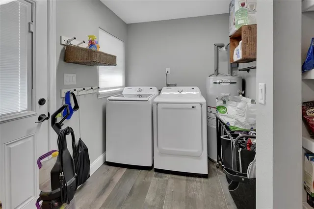 a view of storage and utility room with washer and dryer
