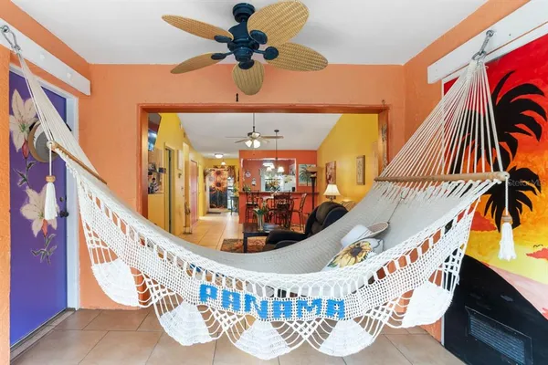 a bathroom with a toilet and a shower curtain