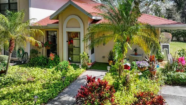 a kitchen with a refrigerator and a sink