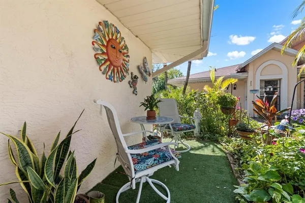 a view of a house with a small yard and plants