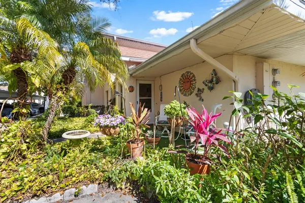 an outdoor space with pool and trees