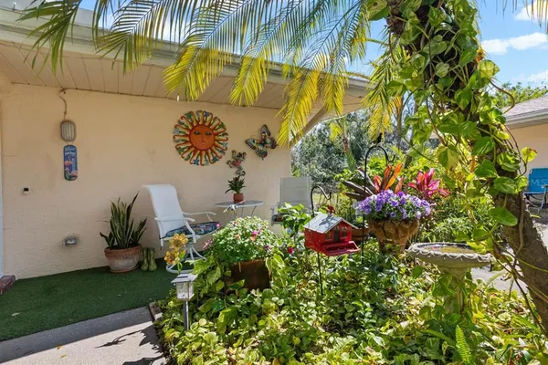 a living room with lots of furniture and a large window