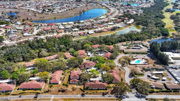 an aerial view of a house with a yard