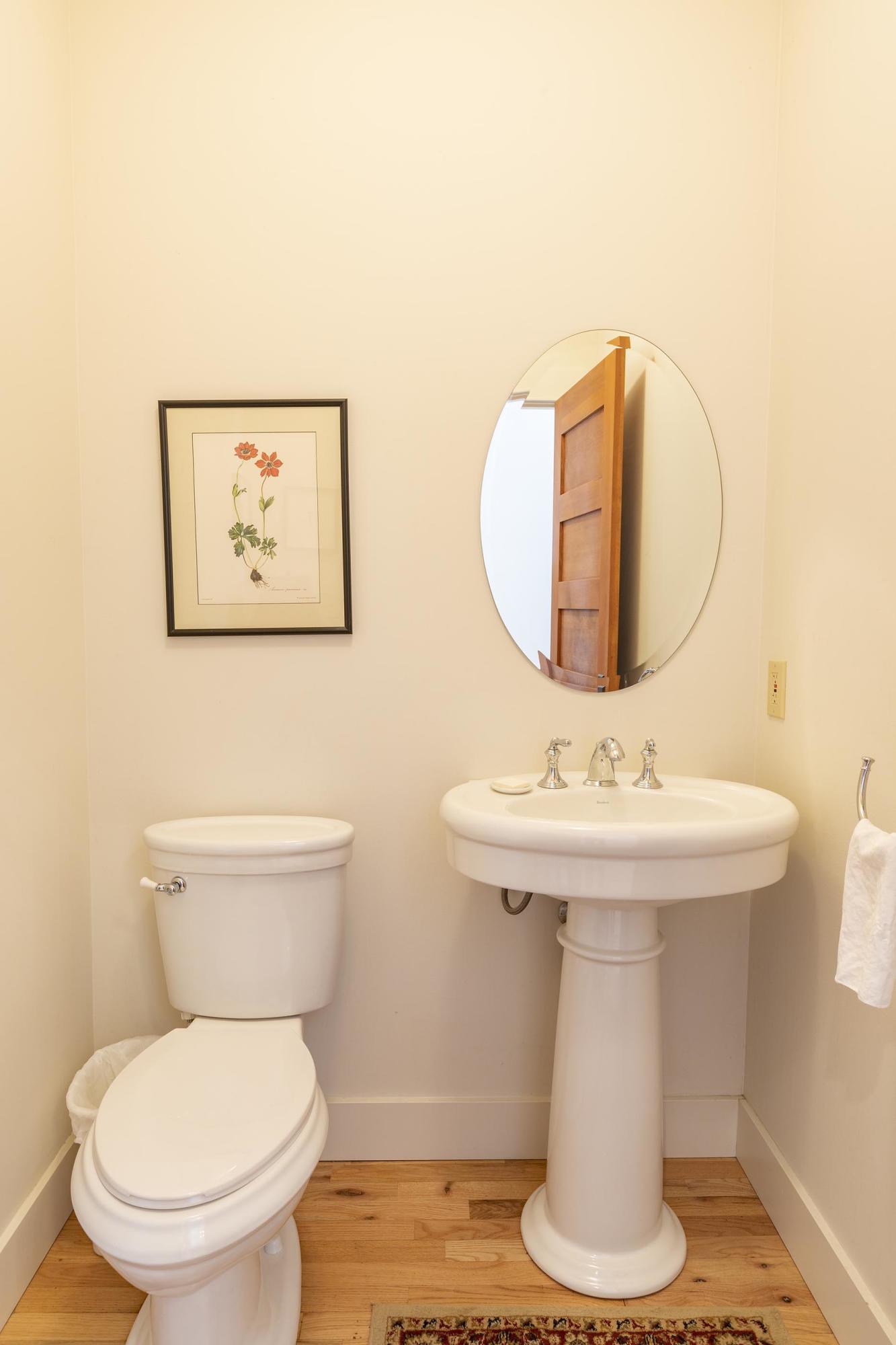 310 40aa Road Norwood, CO 81423 - Photo 11 of 35 a bathroom with a toilet sink and mirror