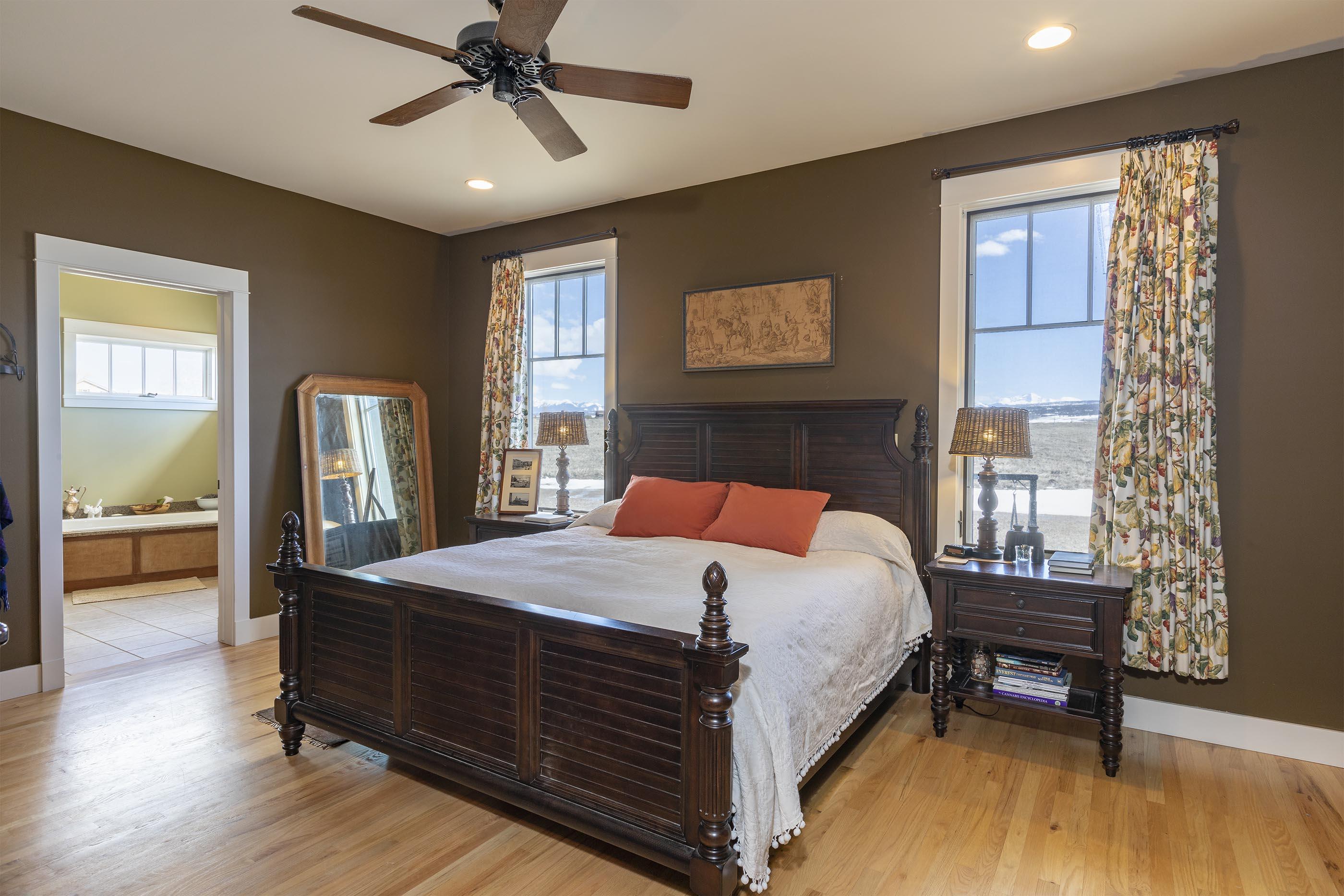 310 40aa Road Norwood, CO 81423 - Photo 12 of 35 a bedroom with a bed and a chandelier