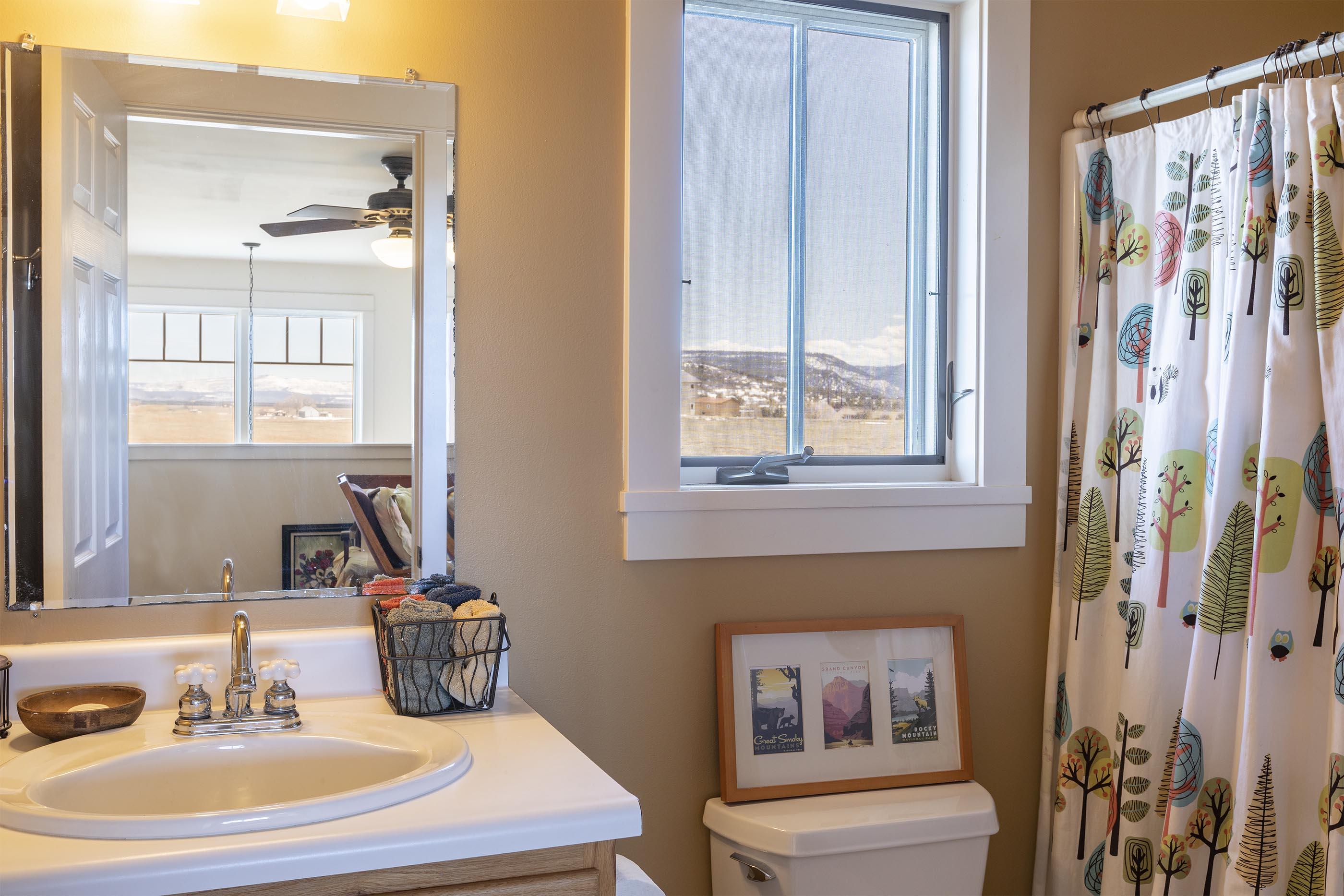 310 40aa Road Norwood, CO 81423 - Photo 17 of 35 a bathroom with a sink and a mirror