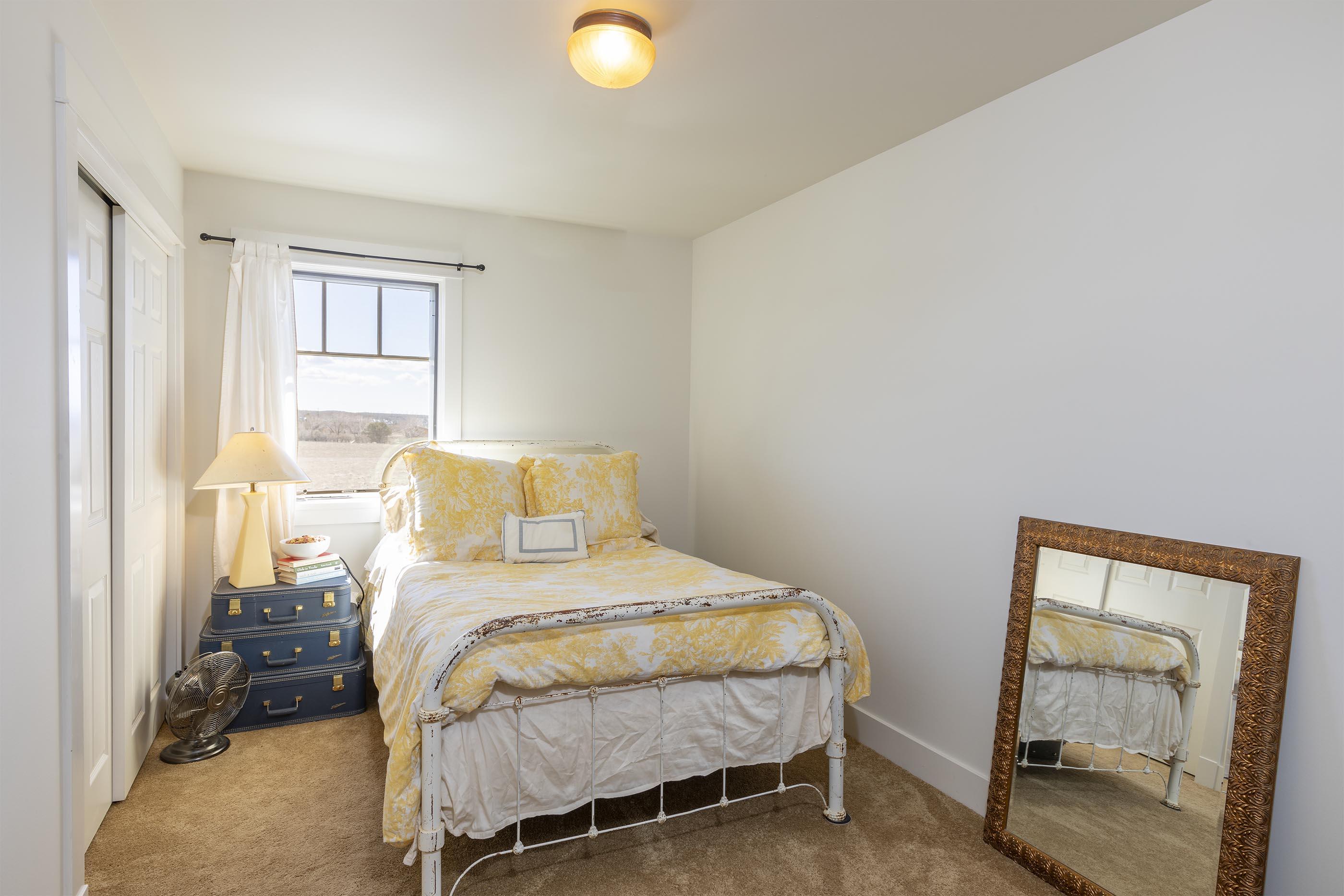 310 40aa Road Norwood, CO 81423 - Photo 20 of 35 a bedroom with a bed and a mirror
