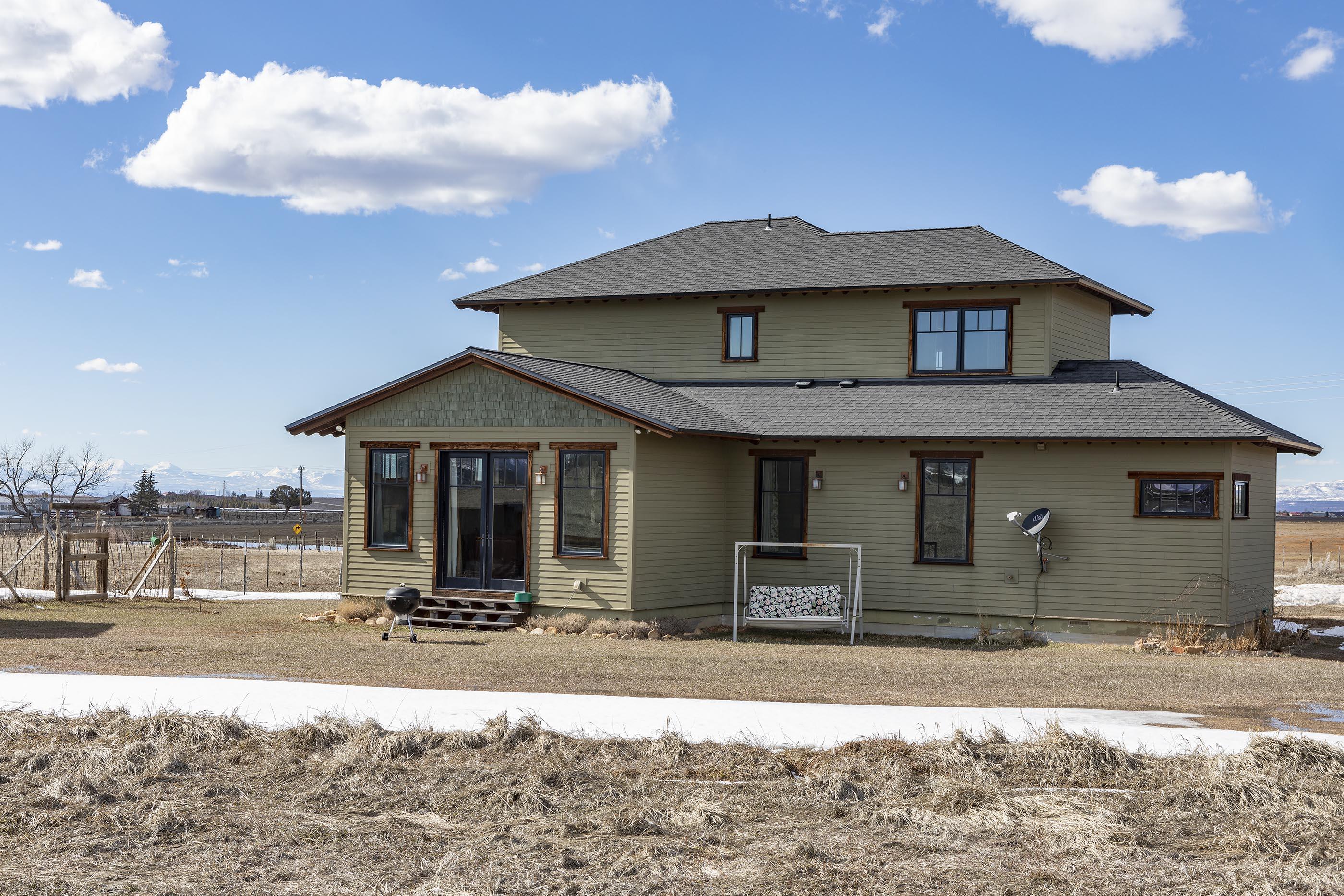 310 40aa Road Norwood, CO 81423 - Photo 2 of 35 a front view of a house with garden