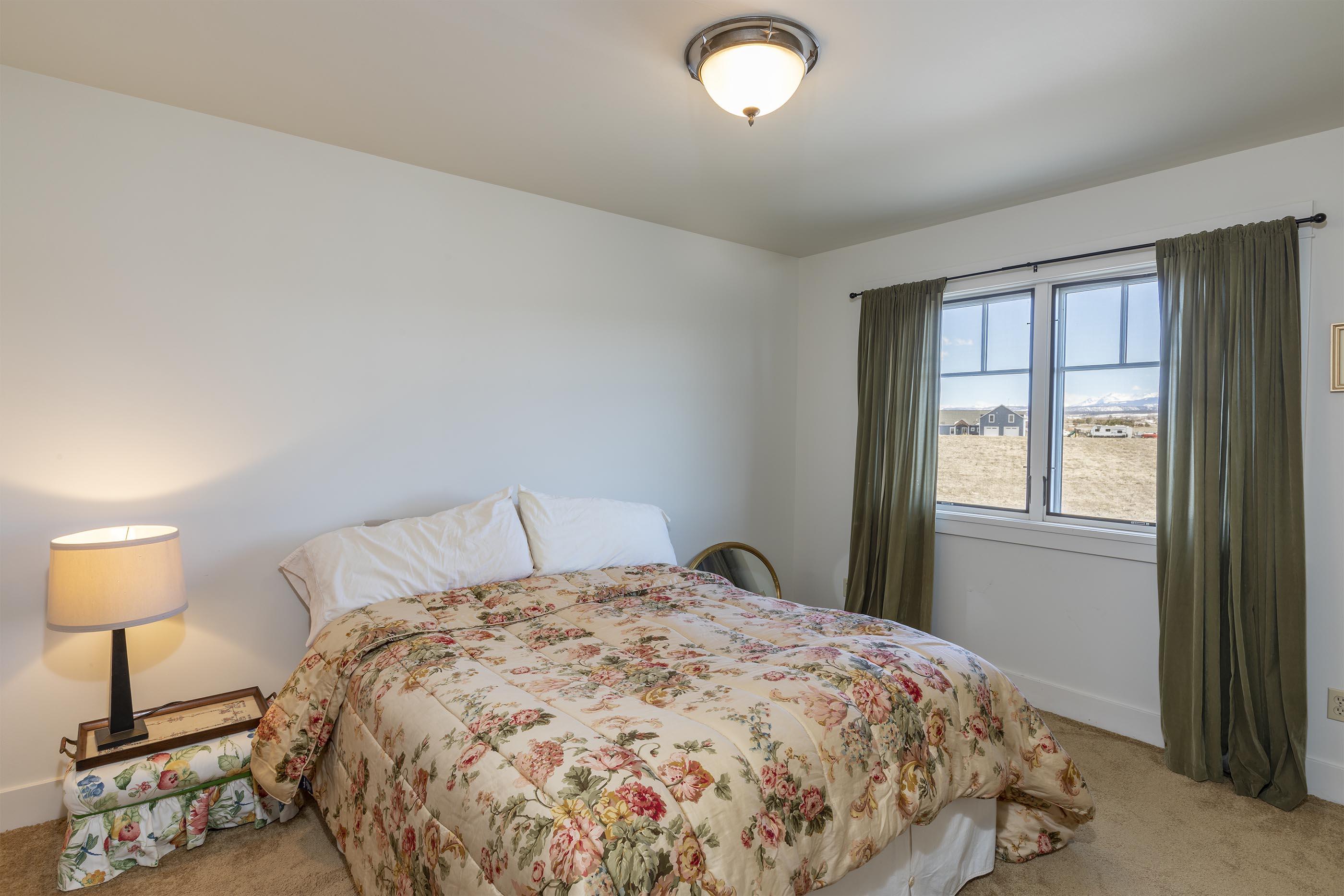 310 40aa Road Norwood, CO 81423 - Photo 21 of 35 a bedroom with a bed and a lamp