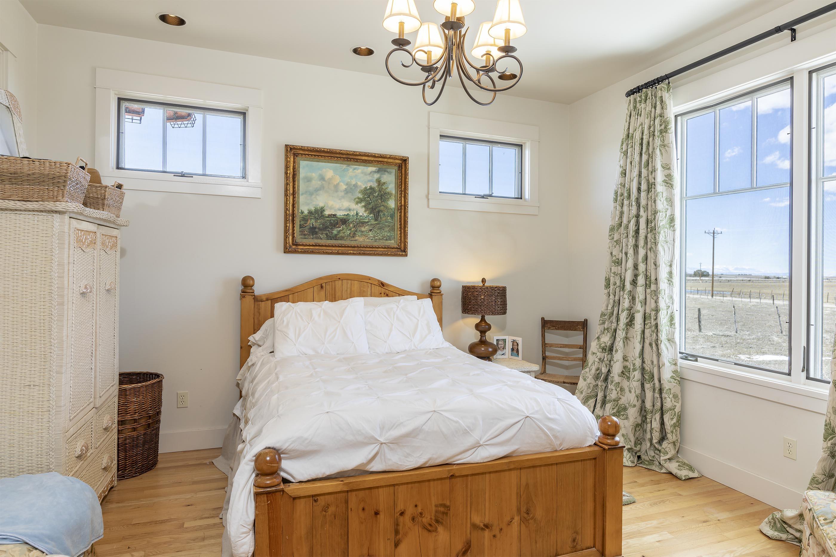 310 40aa Road Norwood, CO 81423 - Photo 22 of 35 a bed sitting in a bedroom next to a window