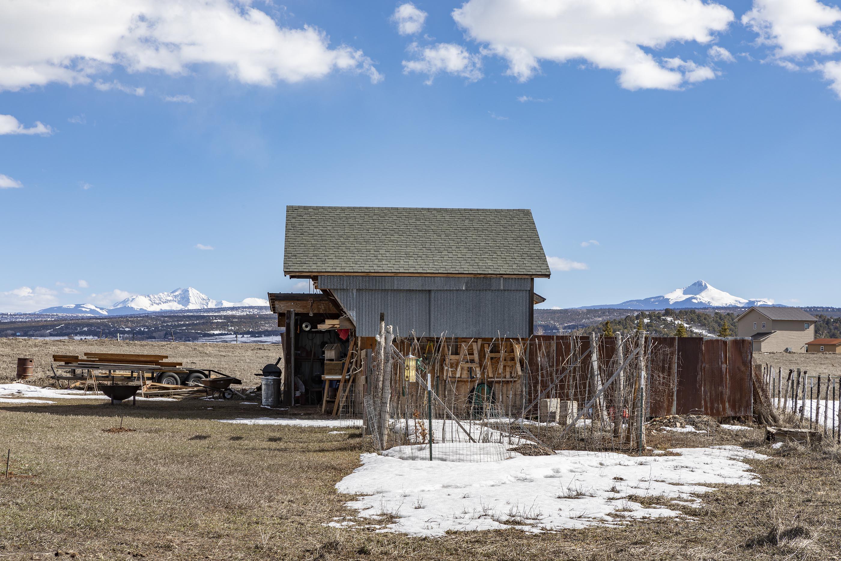 310 40aa Road Norwood, CO 81423 - Photo 30 of 35 a view of a house with a snow in the background