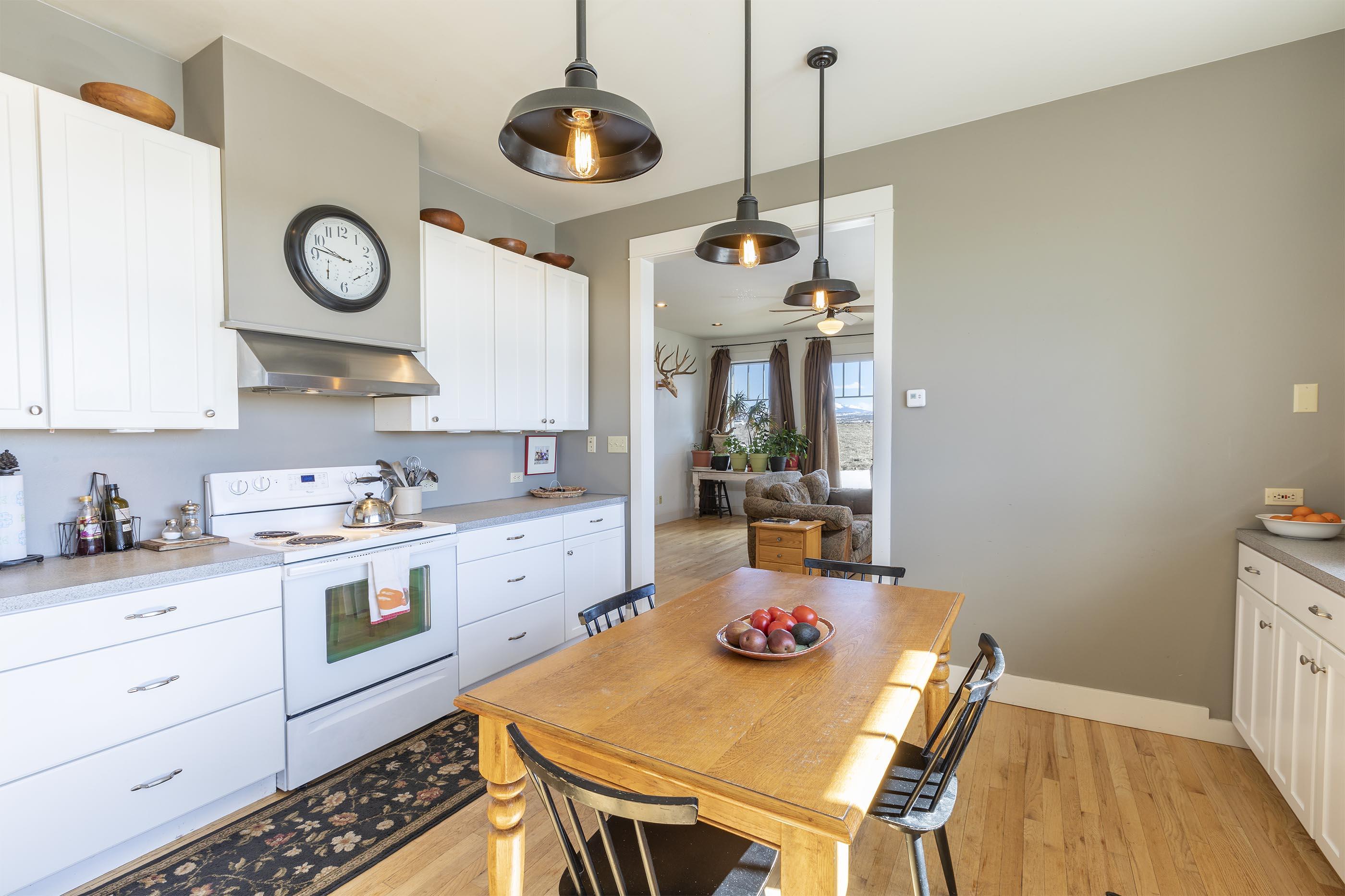 310 40aa Road Norwood, CO 81423 - Photo 4 of 35 a kitchen with a table and chairs in it