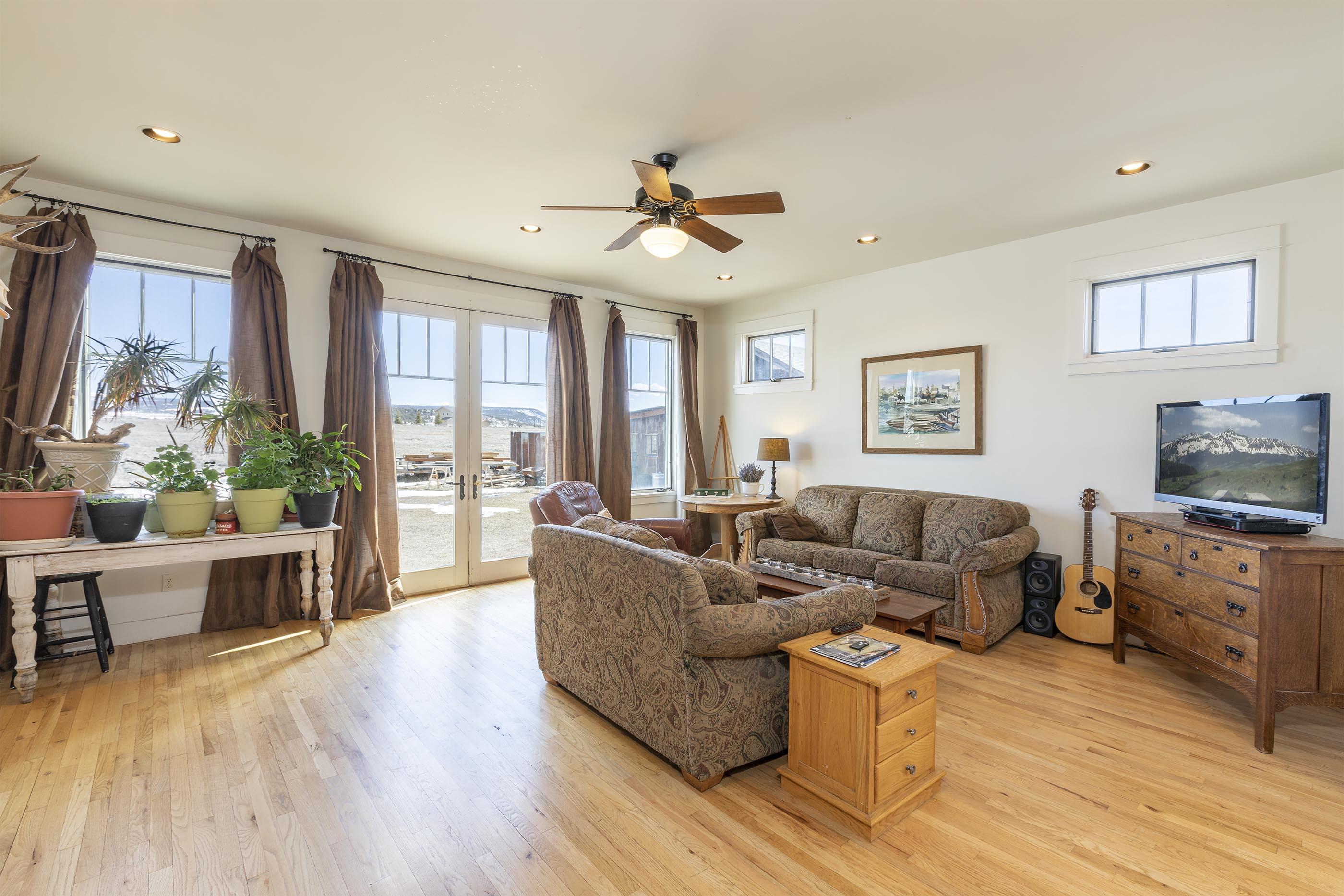 310 40aa Road Norwood, CO 81423 - Photo 10 of 35 a living room with furniture and a flat screen tv