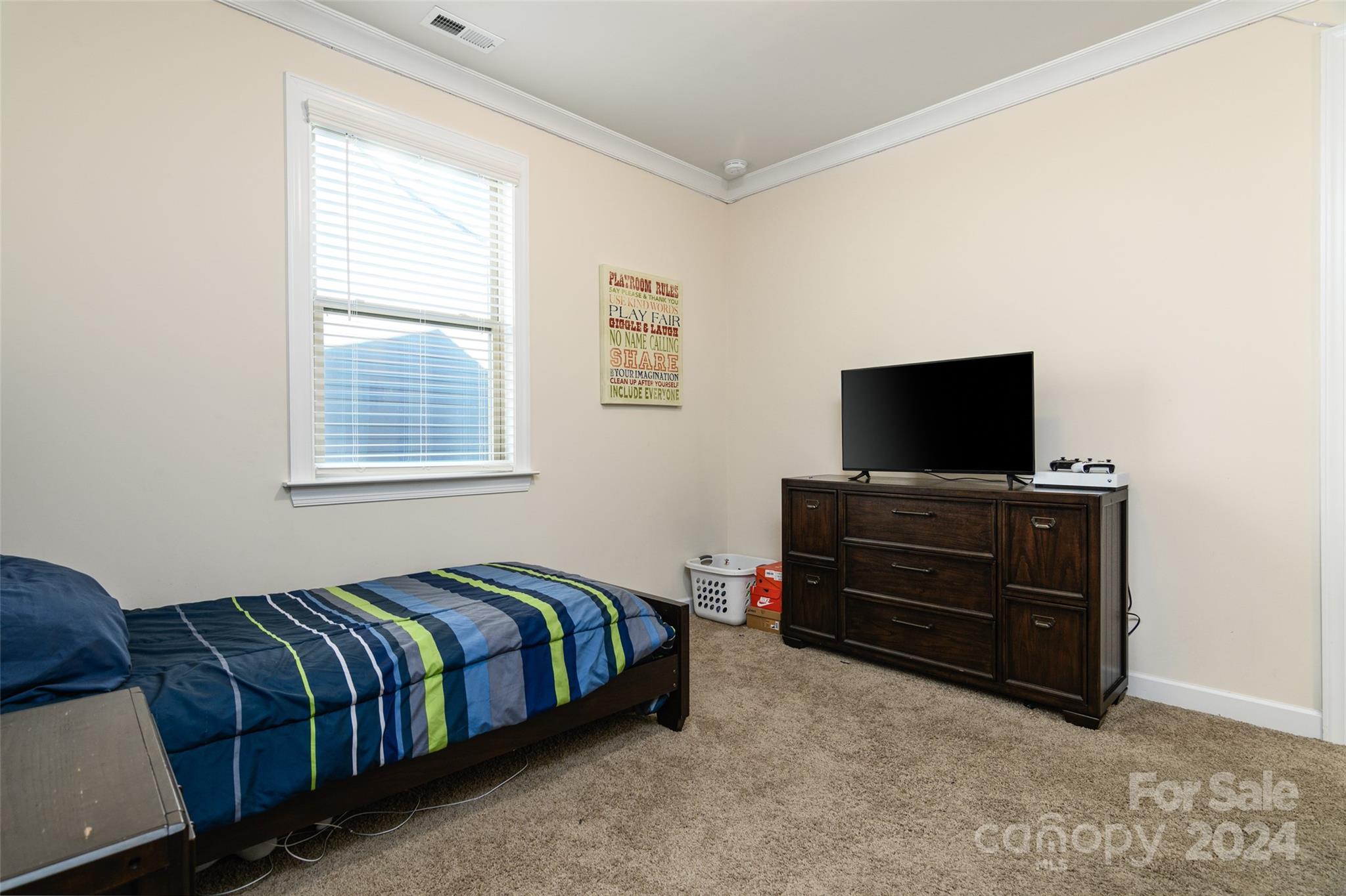 1435 Liberty Row Drive Fort Mill, SC 29708 - Photo 23 of 34 a bedroom with a bed and a flat screen tv