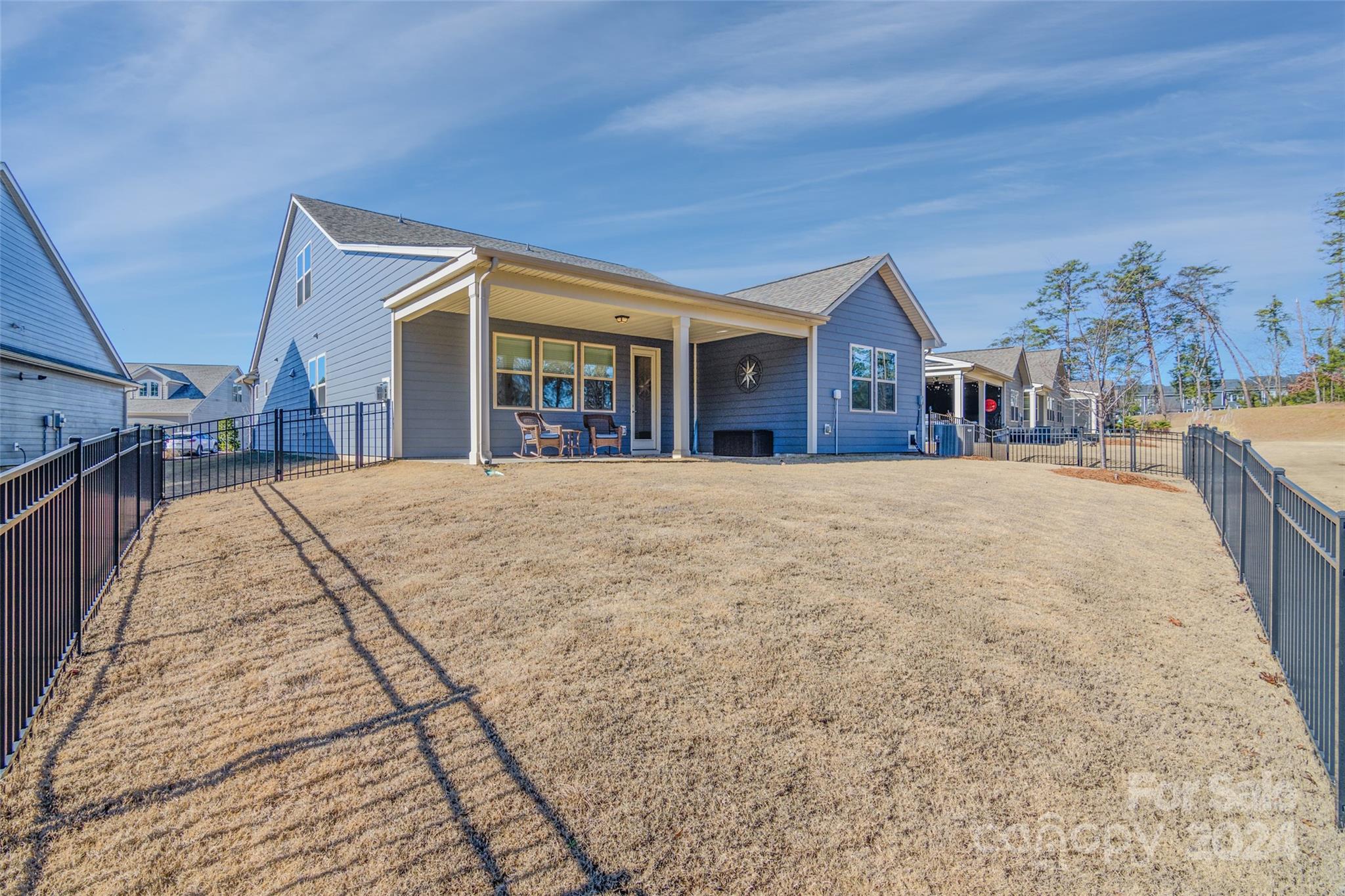 1435 Liberty Row Drive Fort Mill, SC 29708 - Photo 29 of 34 a front view of house with yard and trees in the background