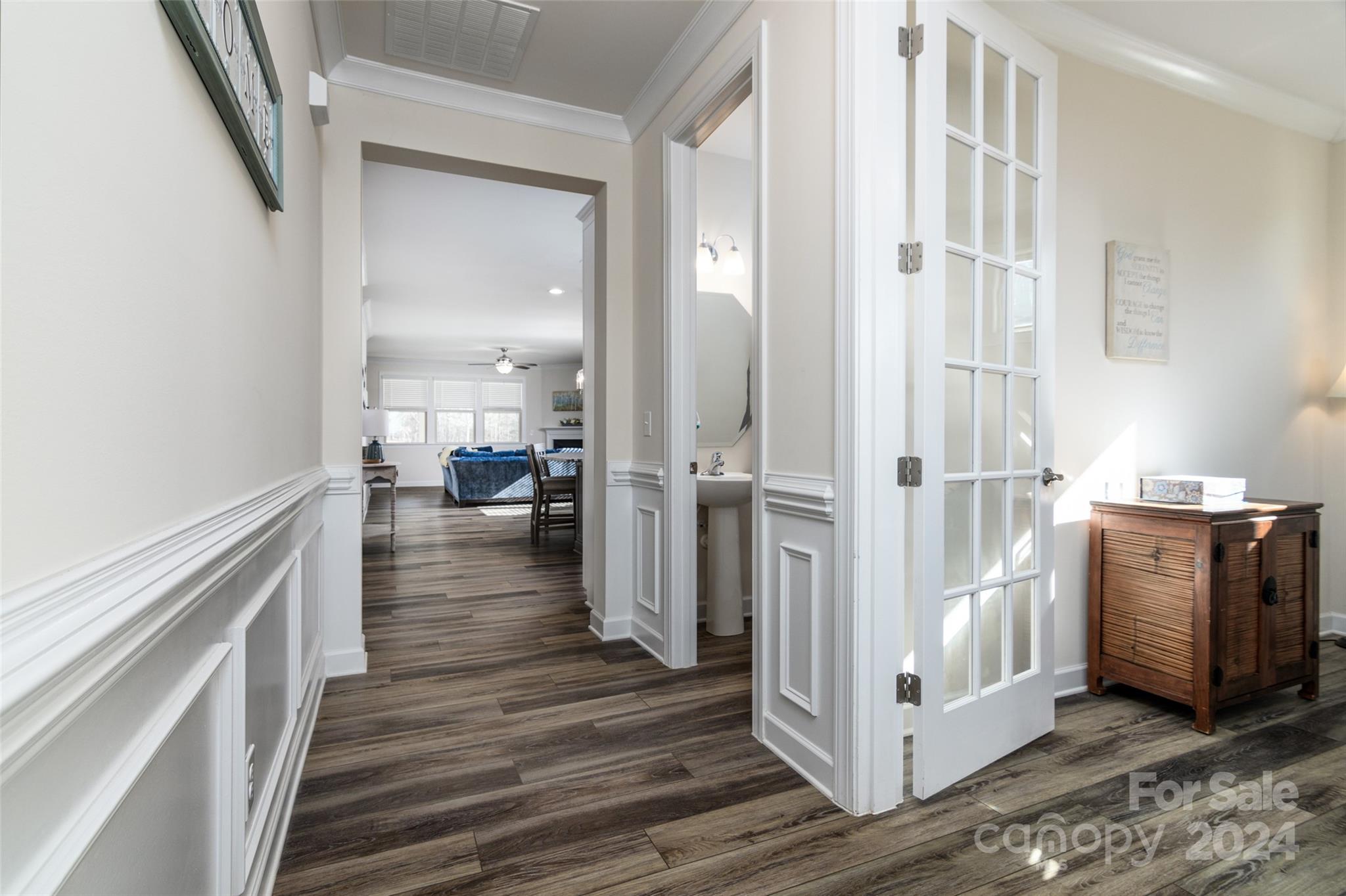 1435 Liberty Row Drive Fort Mill, SC 29708 - Photo 3 of 34 a view of a hallway view with wooden floor and staircase