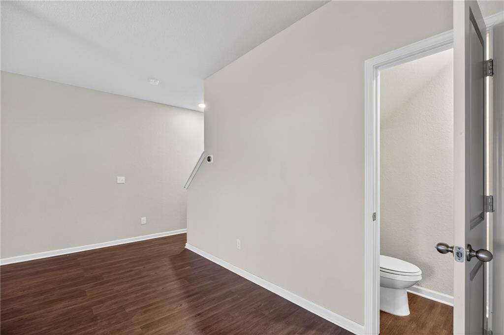 1003 Nandina Court Villa Rica, GA 30180 - Photo 12 of 43 a bathroom with a toilet and a shower