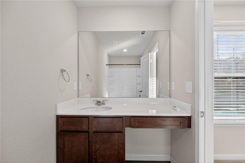 1003 Nandina Court Villa Rica, GA 30180 - Photo 15 of 43 a bathroom with a sink and a mirror