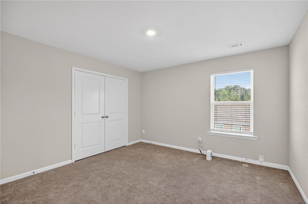 1003 Nandina Court Villa Rica, GA 30180 - Photo 18 of 43 a view of an empty room with a window