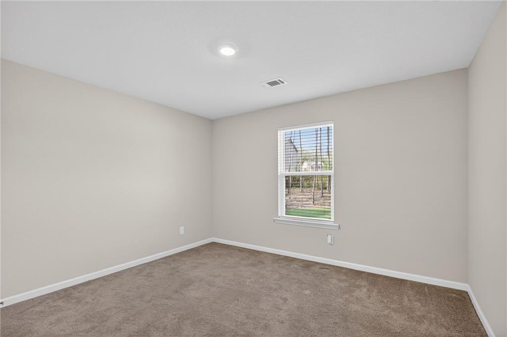 1003 Nandina Court Villa Rica, GA 30180 - Photo 19 of 43 an empty room with a window