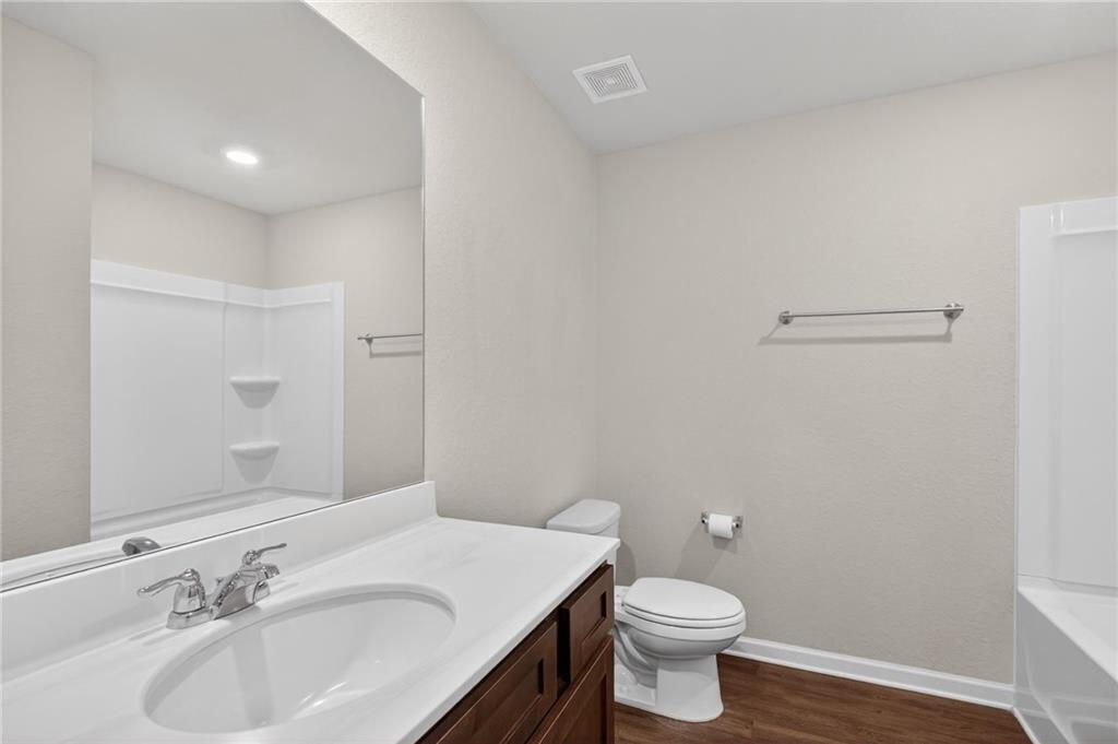 1003 Nandina Court Villa Rica, GA 30180 - Photo 20 of 43 a bathroom with a sink and a toilet
