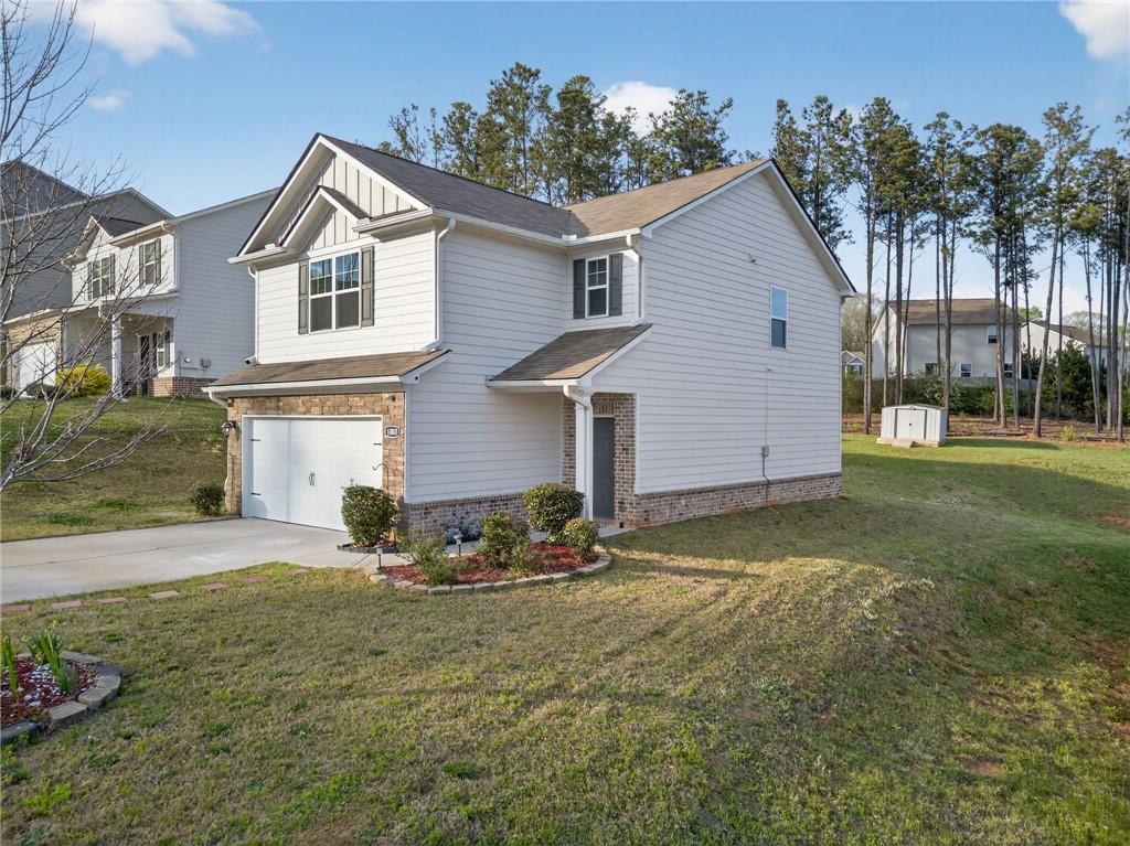 1003 Nandina Court Villa Rica, GA 30180 - Photo 2 of 43 a front view of house with yard