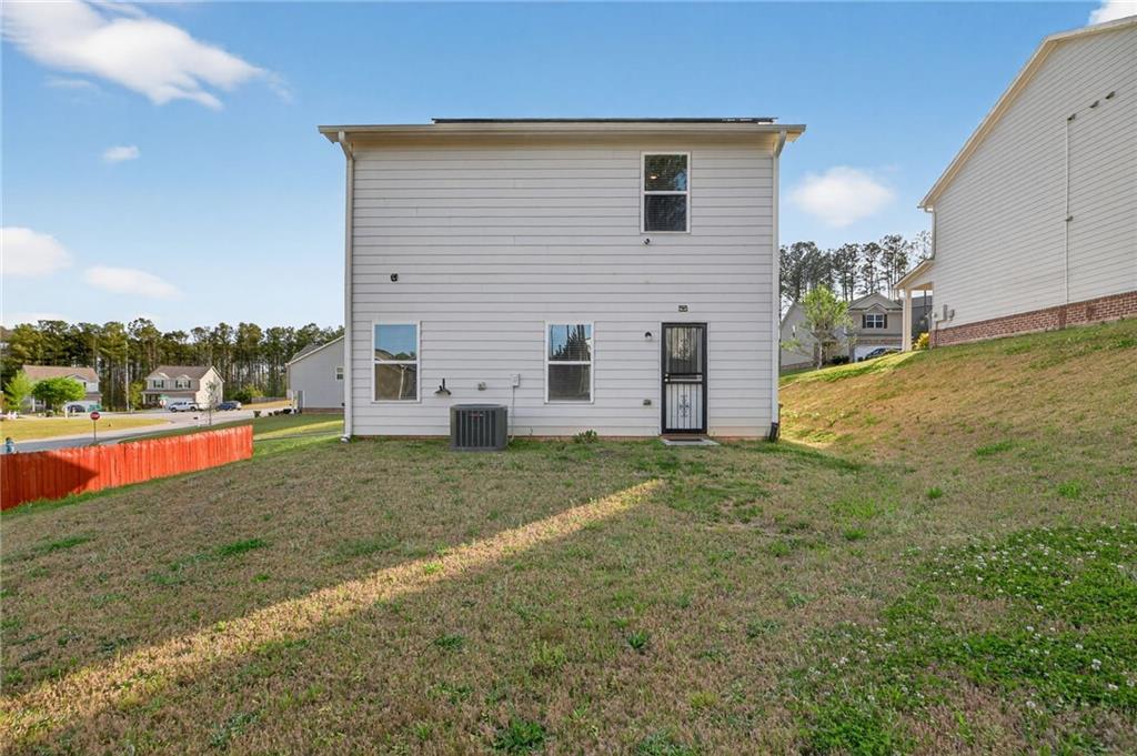 1003 Nandina Court Villa Rica, GA 30180 - Photo 21 of 43 a view of a house with backyard and garden