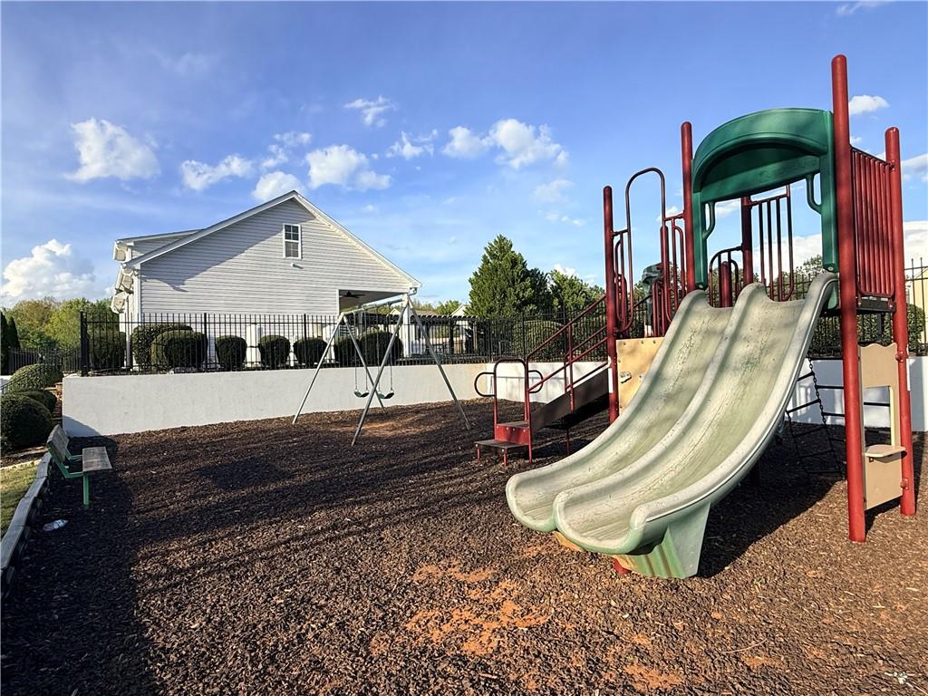 1003 Nandina Court Villa Rica, GA 30180 - Photo 32 of 43 a view of a chair and tables in the patio