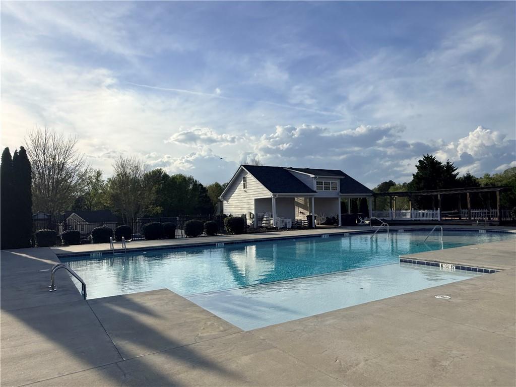 1003 Nandina Court Villa Rica, GA 30180 - Photo 35 of 43 a view of a lake with houses in the back