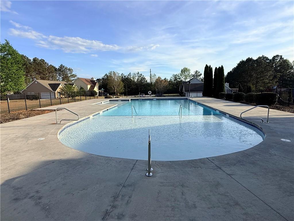 1003 Nandina Court Villa Rica, GA 30180 - Photo 36 of 43 a view of a swimming pool with a yard