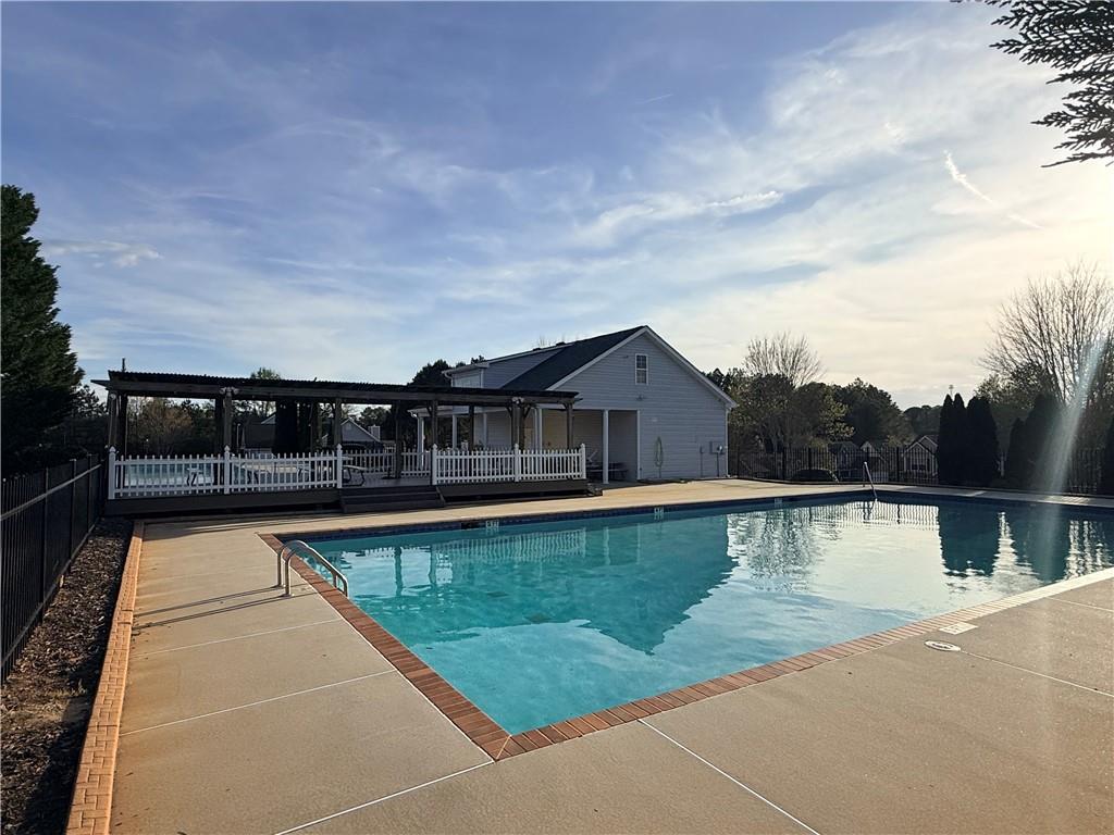 1003 Nandina Court Villa Rica, GA 30180 - Photo 37 of 43 a view of swimming pool with a yard