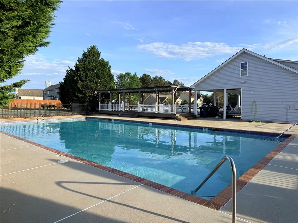 1003 Nandina Court Villa Rica, GA 30180 - Photo 39 of 43 a view of a swimming pool with an outdoor seating