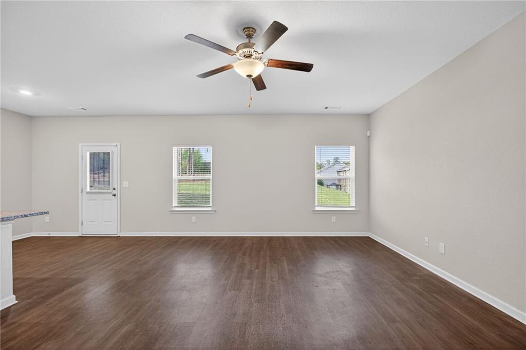 1003 Nandina Court Villa Rica, GA 30180 - Photo 4 of 43 an empty room with wooden floor and windows