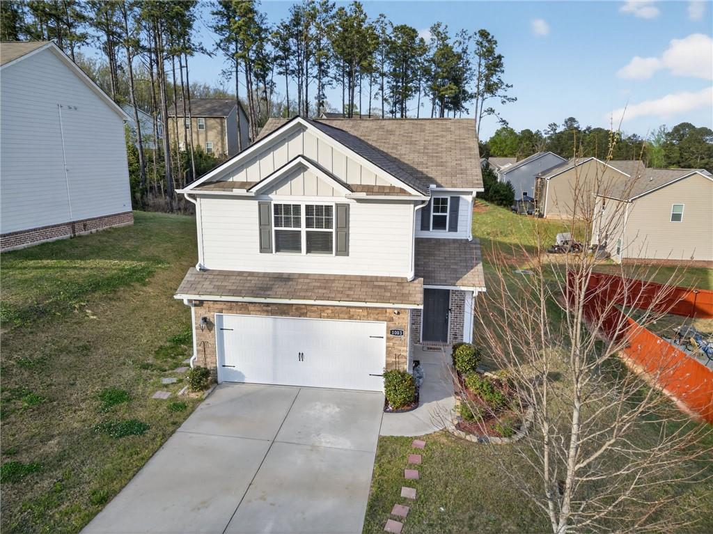 1003 Nandina Court Villa Rica, GA 30180 - Photo 43 of 43 a front view of a house with a yard and garage