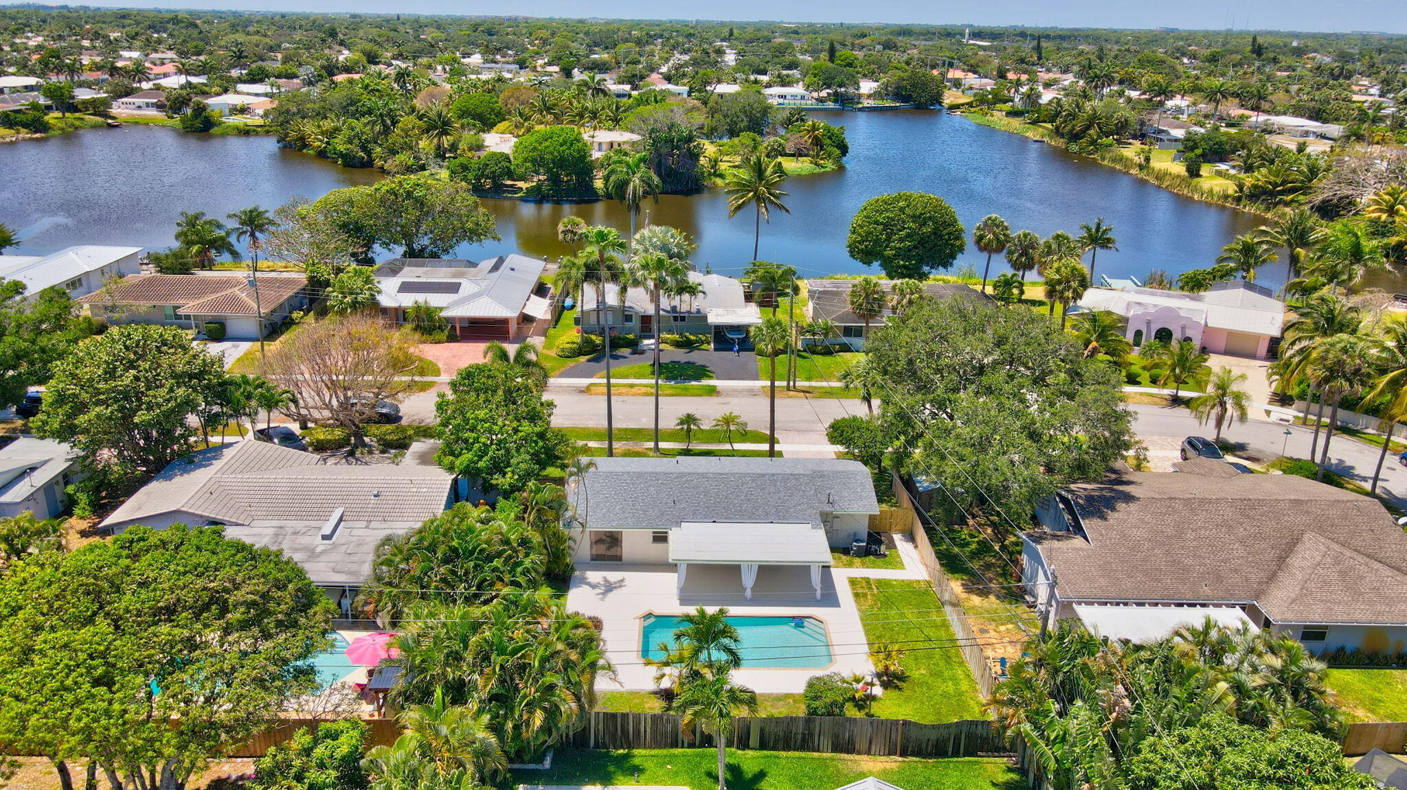 832 Southwest 10th Avenue Boca Raton, FL 33486 - Photo 50 of 57 an aerial view of a house with a garden and lake view