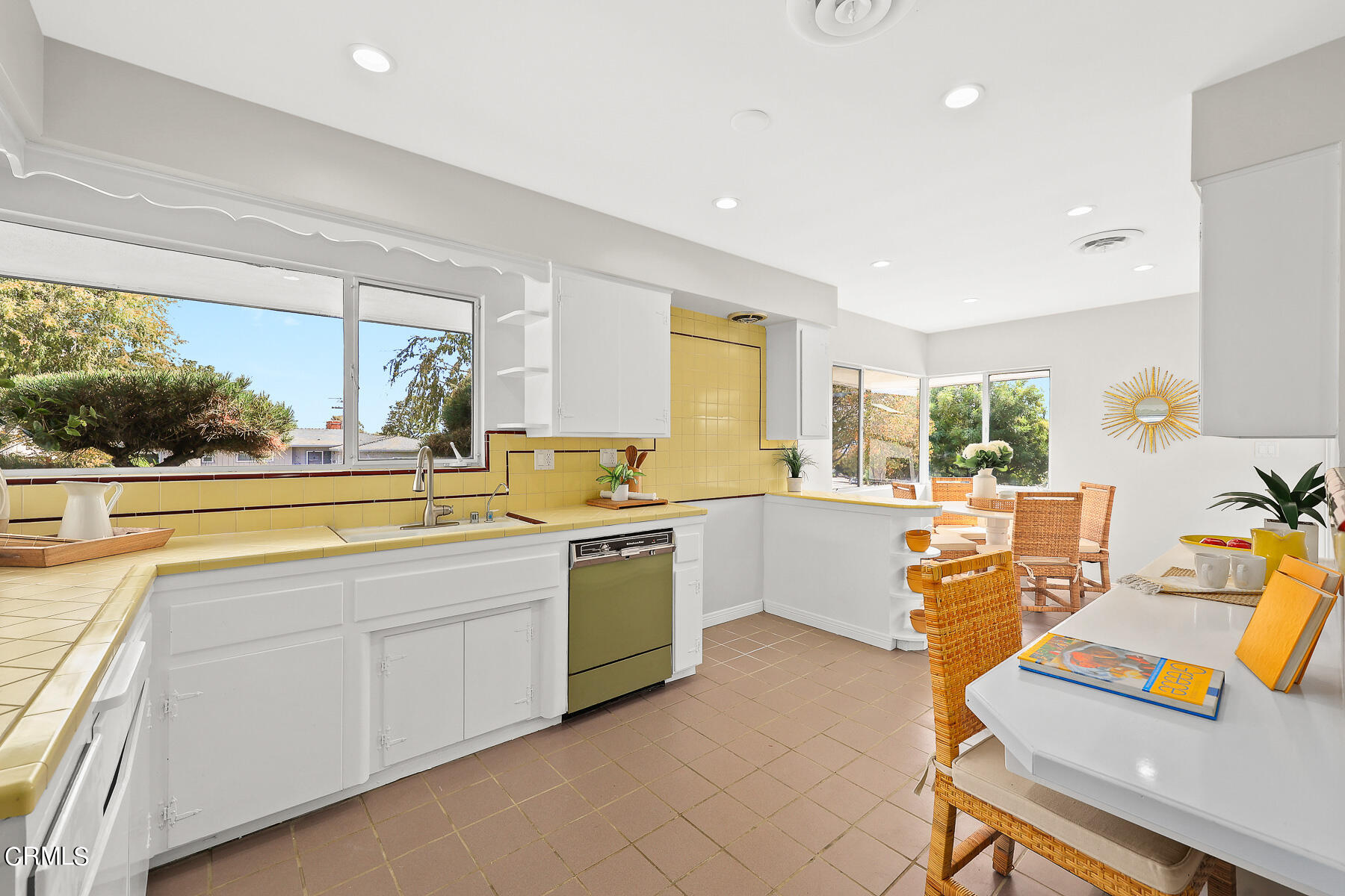 515 Cliff Drive Pasadena, CA 91107 - Photo 11 of 37 a open kitchen with stainless steel appliances kitchen island granite countertop a sink and white cabinets next to a window