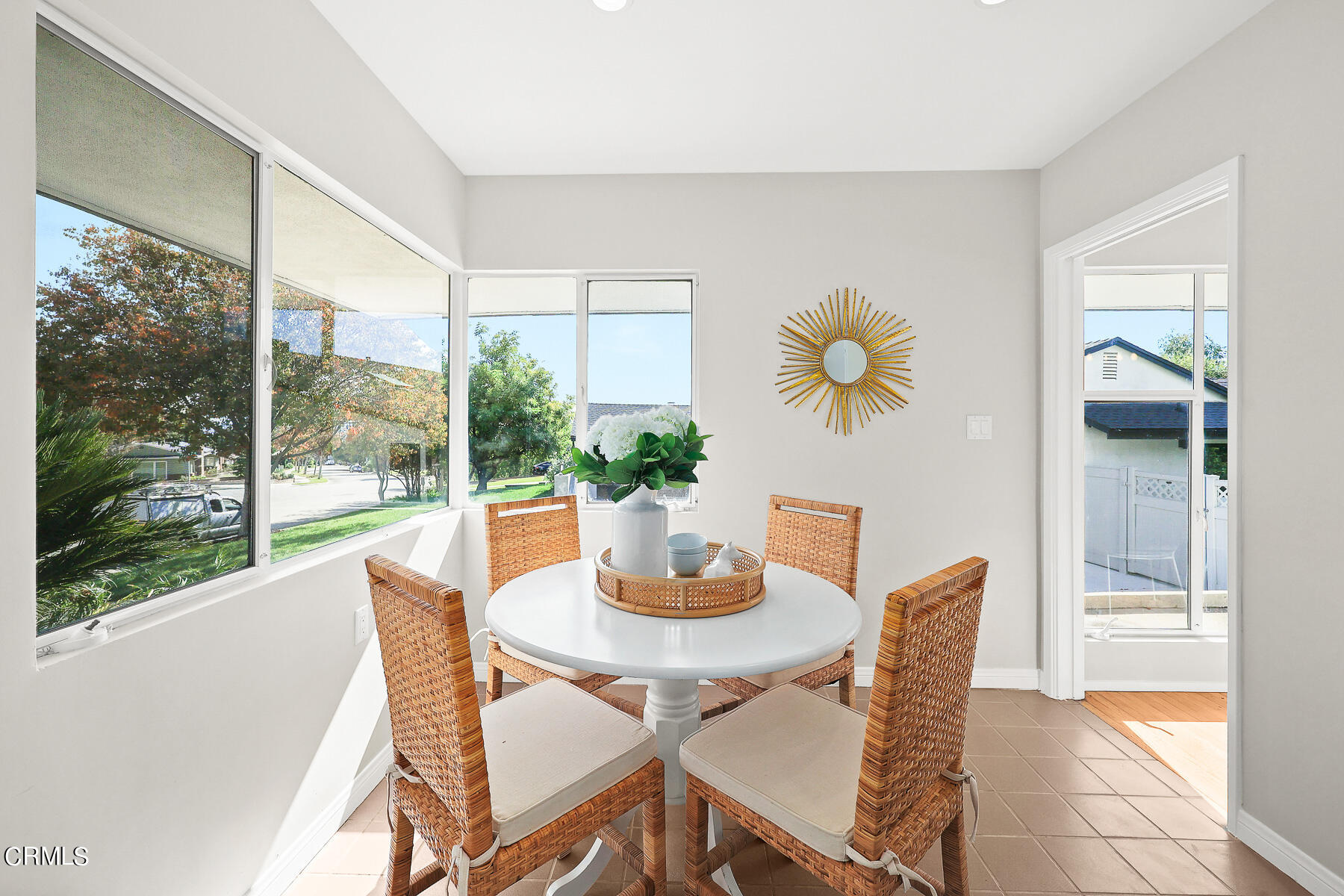 515 Cliff Drive Pasadena, CA 91107 - Photo 15 of 37 a dining room with furniture wooden floor and a potted plant