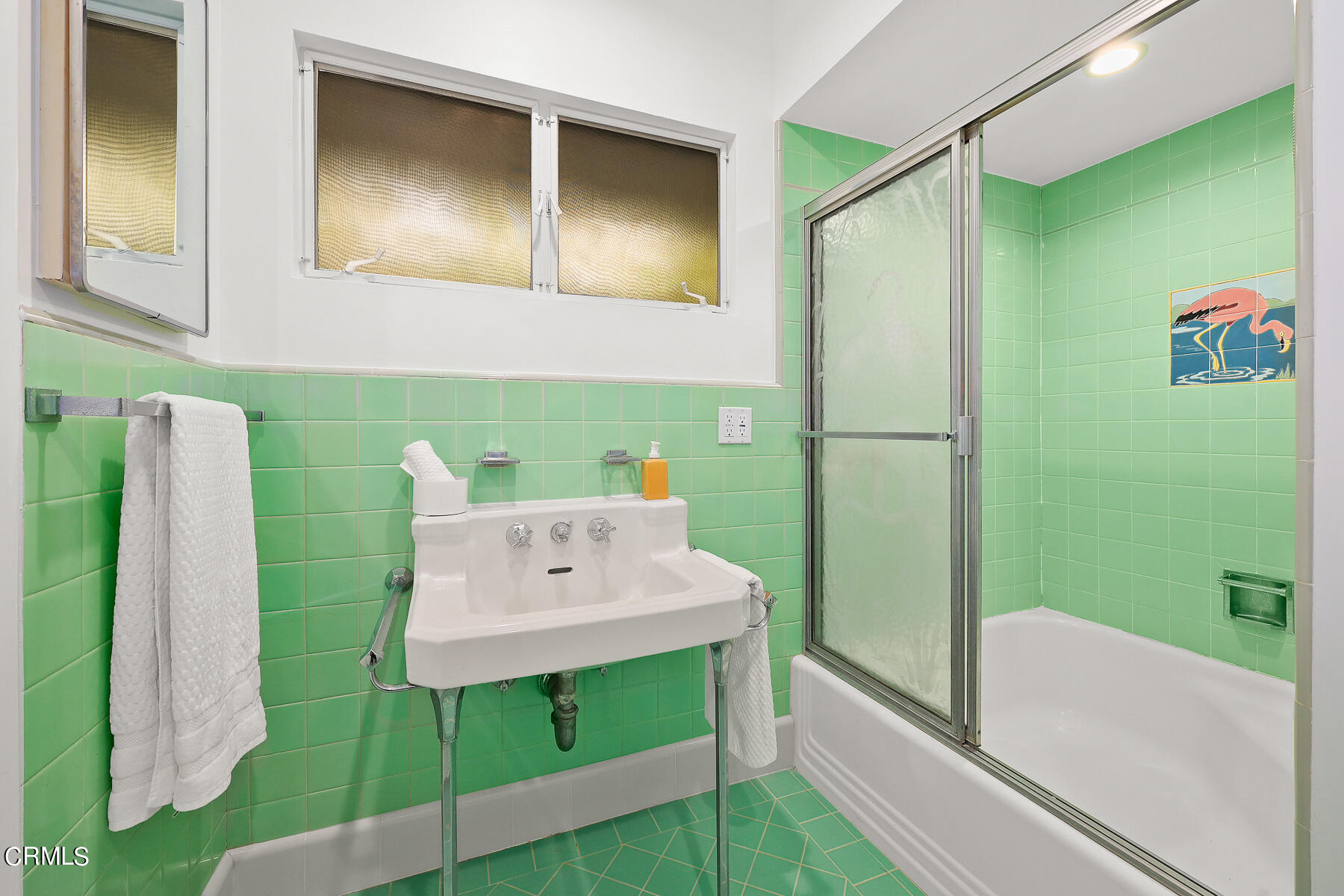 515 Cliff Drive Pasadena, CA 91107 - Photo 21 of 37 a bathroom with a sink mirror and a shower