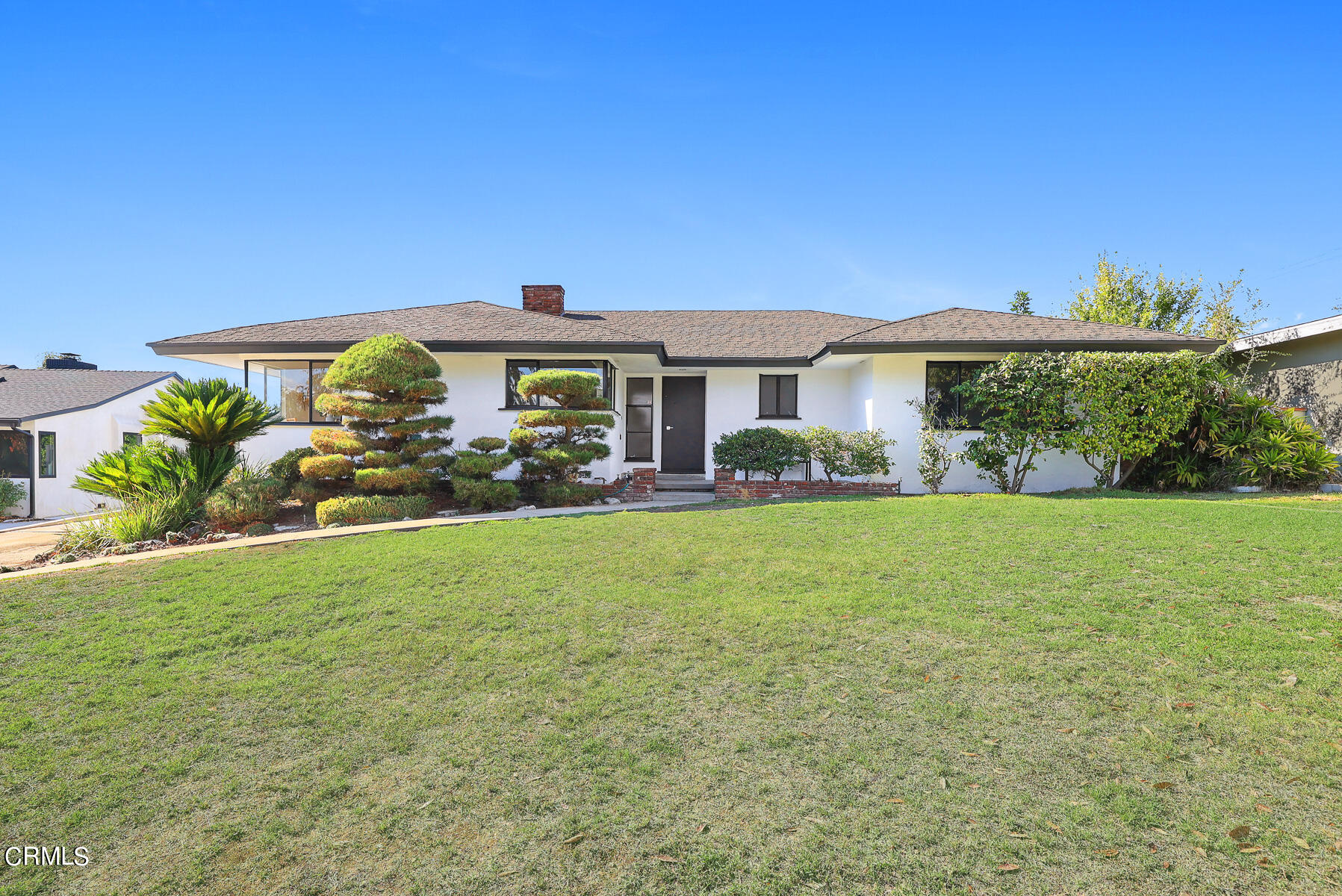 515 Cliff Drive Pasadena, CA 91107 - Photo 3 of 37 a front view of a house with garden