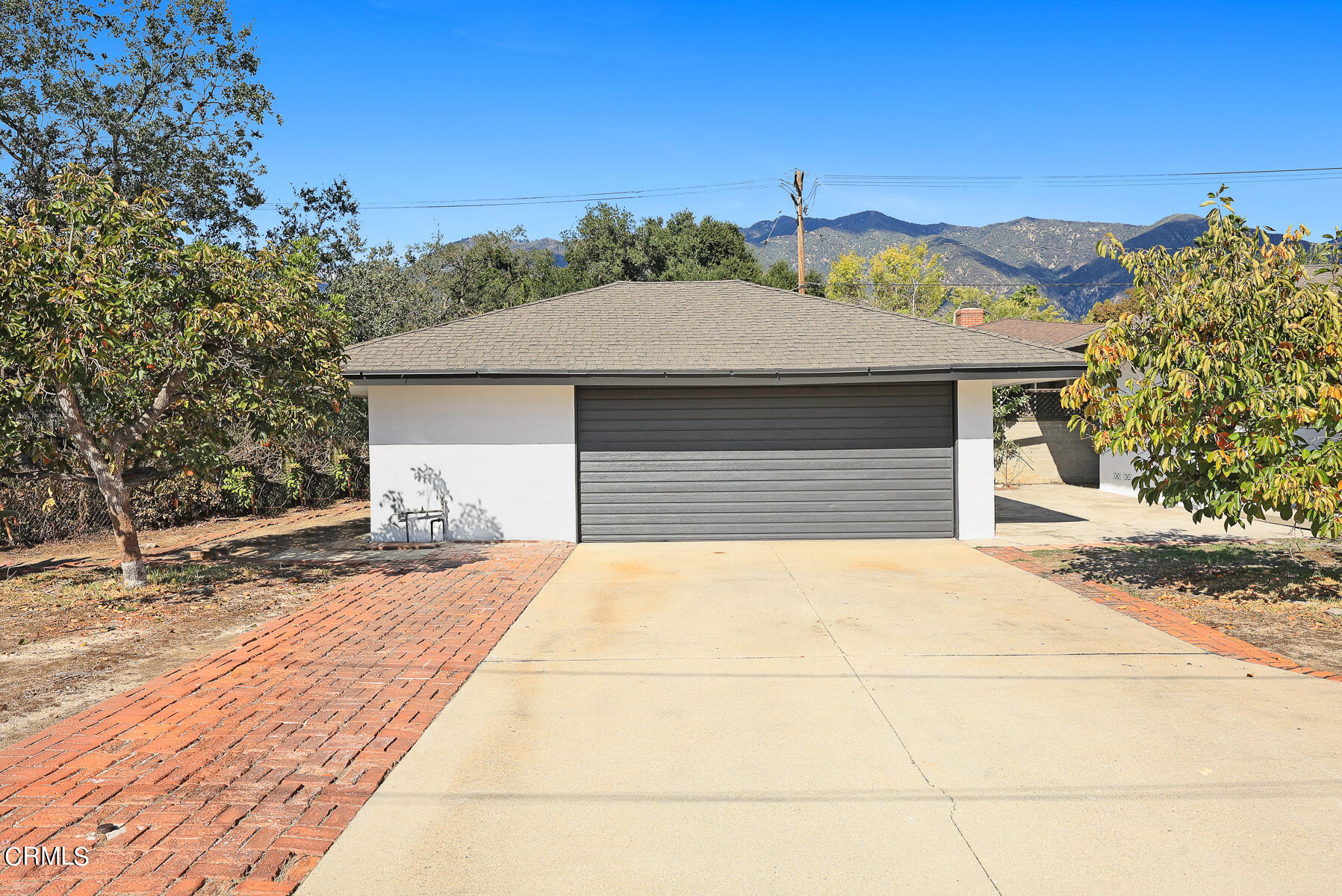515 Cliff Drive Pasadena, CA 91107 - Photo 32 of 37 a front view of a house with a yard and garage