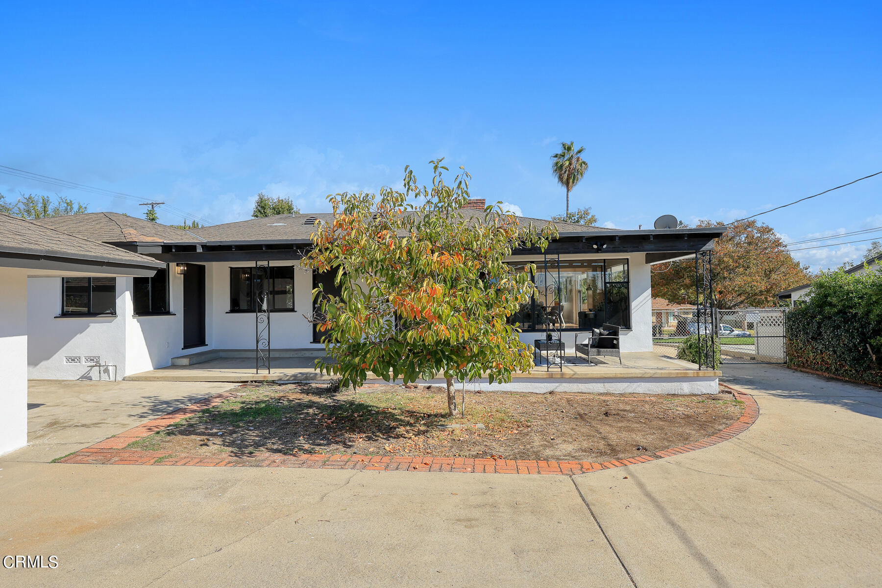515 Cliff Drive Pasadena, CA 91107 - Photo 33 of 37 a view of a white house with a outdoor space next to a road