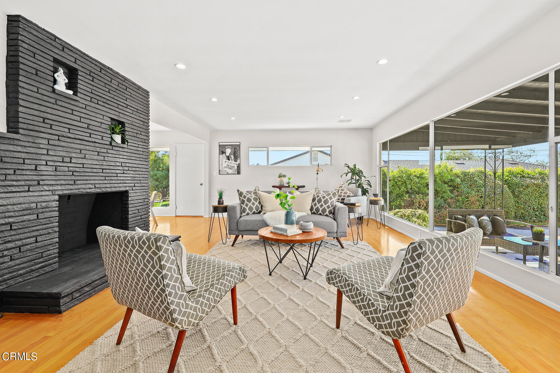 515 Cliff Drive Pasadena, CA 91107 - Photo 7 of 37 a living room with patio furniture and a fireplace